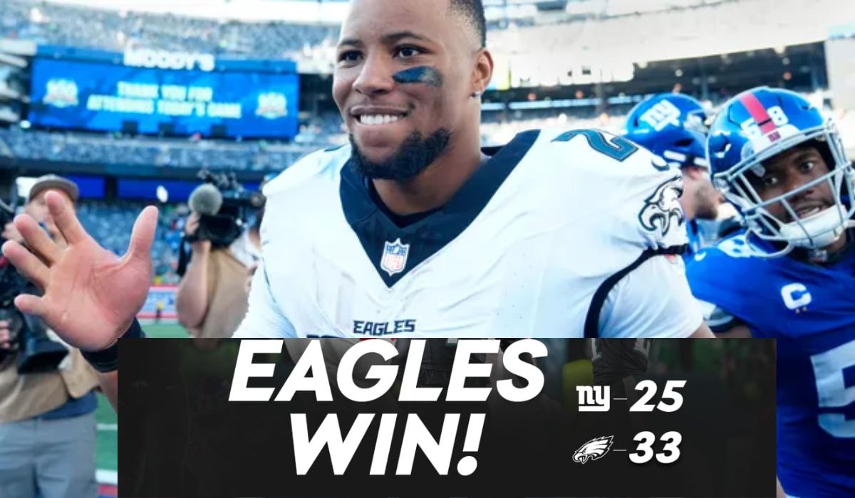 Philadelphia Eagles player celebrating victory over New York Giants with final score 33-25 displayed on screen, Eagles win banner in foreground. Philadelphia eagles vs new york giants match player stats.