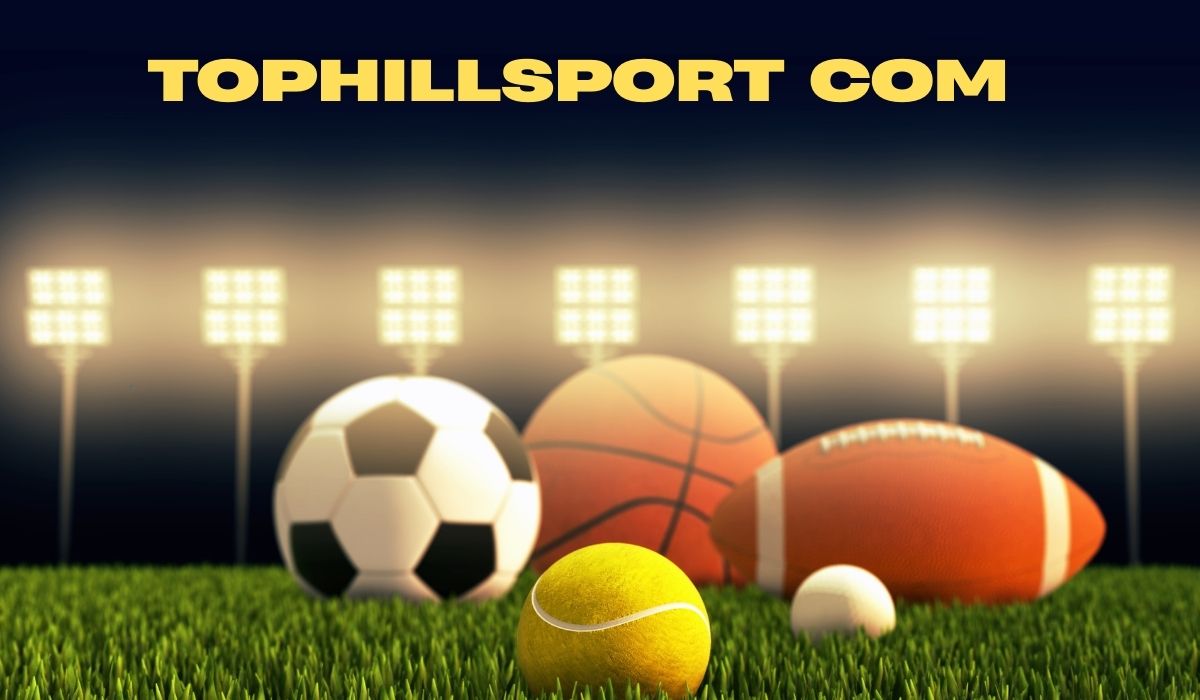 Tophillsport com sports banner featuring soccer ball, basketball, tennis ball, baseball, and football on green grass under stadium floodlights.